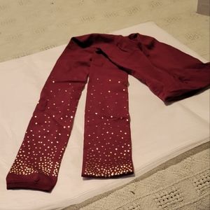 Light weight burgundy leggings with gold stars in lower leg
